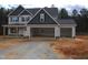 Attractive two-story home with a two-car garage, showcasing a design with great curb appeal at 358 Coats Ridge Dr, Benson, NC 27504