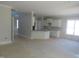 Open-concept interior space featuring white trim, multiple windows, and well-defined areas for living and dining at 358 Coats Ridge Dr, Benson, NC 27504