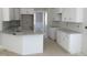Bright kitchen featuring white cabinets, granite countertops, and modern fixtures, awaiting your personal touch at 358 Coats Ridge Dr, Benson, NC 27504