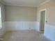 Empty room with wainscoting detail and awaiting your personal touch at 358 Coats Ridge Dr, Benson, NC 27504