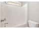 Bathroom featuring a sleek, modern shower-tub combination with bright, neutral finishes at 3910 Wedonia Dr, Cary, NC 27519
