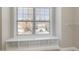 Cozy bedroom alcove featuring a built-in bench and shelving under a window at 3910 Wedonia Dr, Cary, NC 27519