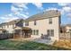 Rear exterior of a two-story home featuring a screened porch and spacious backyard at 3910 Wedonia Dr, Cary, NC 27519