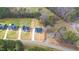Aerial view of new construction homes with long driveways and surrounding landscape at 4017 Mebane Oaks Rd, Mebane, NC 27302