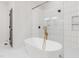 Modern bathroom with a freestanding tub and tiled walk-in shower at 4017 Mebane Oaks Rd, Mebane, NC 27302