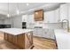 Beautiful kitchen with large island, modern range hood, and stainless steel appliances at 4017 Mebane Oaks Rd, Mebane, NC 27302