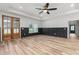 Spacious living room featuring hardwood floors and a glass-panelled door leading to the outside at 4017 Mebane Oaks Rd, Mebane, NC 27302
