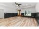 Spacious living area with French doors, a view to the yard, and dark wainscoting at 4017 Mebane Oaks Rd, Mebane, NC 27302