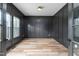Private office with board and batten accent, wood-look floors and large windows at 4017 Mebane Oaks Rd, Mebane, NC 27302