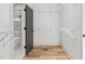 Walk-in closet featuring wire shelving and access to a bathtub and shower at 4017 Mebane Oaks Rd, Mebane, NC 27302