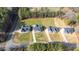 Aerial view of homes with landscaped yards and private driveways, showcasing the neighborhood's layout and charm at 4037 Mebane Oaks Rd, Mebane, NC 27302