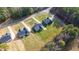 Aerial view of neighborhood residences, illustrating the well-maintained lawns and convenient road access at 4037 Mebane Oaks Rd, Mebane, NC 27302