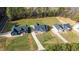 Stunning aerial view of three modern homes with large yards and private driveways amid lush greenery at 4037 Mebane Oaks Rd, Mebane, NC 27302