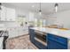 Well-equipped kitchen with a center island, stainless steel appliances, and bright white cabinetry at 4037 Mebane Oaks Rd, Mebane, NC 27302