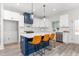Bright eat-in kitchen with white cabinets, stainless appliances, and a blue island at 4037 Mebane Oaks Rd, Mebane, NC 27302