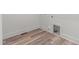 Laundry hookups with wood-style floors and white baseboards at 4037 Mebane Oaks Rd, Mebane, NC 27302
