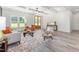 Bright living room with hardwood floors, coffered ceiling, and comfortable seating at 4037 Mebane Oaks Rd, Mebane, NC 27302