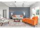 Stylish living room with coffered ceiling, modern furniture, and a decorative accent wall at 4037 Mebane Oaks Rd, Mebane, NC 27302