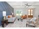 Bright and airy living room showcasing stylish furniture, coffered ceilings, and elegant hardwood floors at 4037 Mebane Oaks Rd, Mebane, NC 27302