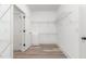 Large walk-in closet with rod and wire shelves on multiple walls at 4037 Mebane Oaks Rd, Mebane, NC 27302
