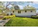 Backyard with a lush lawn, garden area, and space for outdoor activities at 424 S Greensboro St, Carrboro, NC 27510