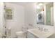 Modern bathroom with integrated washer and dryer and contemporary fixtures at 424 S Greensboro St, Carrboro, NC 27510