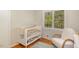 Well-lit Bedroom with crib, comfortable chair and outside views at 424 S Greensboro St, Carrboro, NC 27510