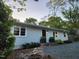 Charming home featuring a well-maintained lawn, stone accents, and a cozy front porch at 424 S Greensboro St, Carrboro, NC 27510