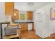 Functional kitchen with vintage appliances and view to the outside at 424 S Greensboro St, Carrboro, NC 27510
