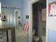 Bathroom with tub and shower and a sink and vanity with ample lighting at 4245 Toccopola St, Raleigh, NC 27604