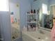 Well lit bathroom with a large vanity and a decorative mirror at 4245 Toccopola St, Raleigh, NC 27604