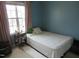 This bedroom offers a quiet and cozy space with natural light at 4245 Toccopola St, Raleigh, NC 27604