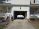 Exterior of the home features an attached garage with white door at 4245 Toccopola St, Raleigh, NC 27604