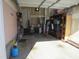 The interior of the attached garage is unfinished with white door at 4245 Toccopola St, Raleigh, NC 27604