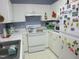 Functional kitchen featuring white cabinets and essential appliances for convenient cooking at 4245 Toccopola St, Raleigh, NC 27604