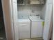 Laundry room with washer, dryer, shelving, and ample storage at 4245 Toccopola St, Raleigh, NC 27604