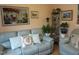 Relaxing living room showcasing a plush sofa, decorative pillows, and elegant wall art at 4245 Toccopola St, Raleigh, NC 27604