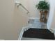 Traditional staircase with carpeted steps and a handrail at 4245 Toccopola St, Raleigh, NC 27604