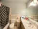 Compact bathroom featuring a sink, toilet, and shower at 4308 Old Chapel Hill Rd Rd, Durham, NC 27707