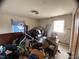 Disorganized bedroom interior with blue flag and natural light at 4308 Old Chapel Hill Rd Rd, Durham, NC 27707