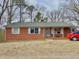 Charming single-story brick home with traditional shutters and a well-maintained lawn at 4308 Old Chapel Hill Rd Rd, Durham, NC 27707