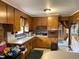 Cozy kitchen space with wood cabinets and vintage appliances at 4308 Old Chapel Hill Rd Rd, Durham, NC 27707