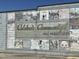 Colorful mural celebrating community past, present, and future on the side of a building at 46 Shortstop Cir, Four Oaks, NC 27524