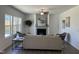 Inviting living room with a fireplace, neutral sofa, and ample natural light at 46 Shortstop Cir, Four Oaks, NC 27524