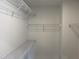 An open walk-in closet features multiple metal shelves for optimal organization and storage at 46 Shortstop Cir, Four Oaks, NC 27524