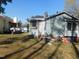 Exterior shot of a home with a backyard that includes clutter at 468 Dickens Dr, Raleigh, NC 27610