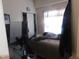 Bedroom with unmade bed, closet, and natural light at 468 Dickens Dr, Raleigh, NC 27610