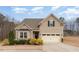 Charming two-story home with light siding, well-kept landscaping, and attached two car garage at 580 Long View Dr, Youngsville, NC 27596