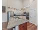 Bright kitchen with stainless steel appliances, granite counters, and a large central island at 580 Long View Dr, Youngsville, NC 27596