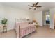 Serene primary bedroom with ceiling fan and neutral decor at 580 Long View Dr, Youngsville, NC 27596